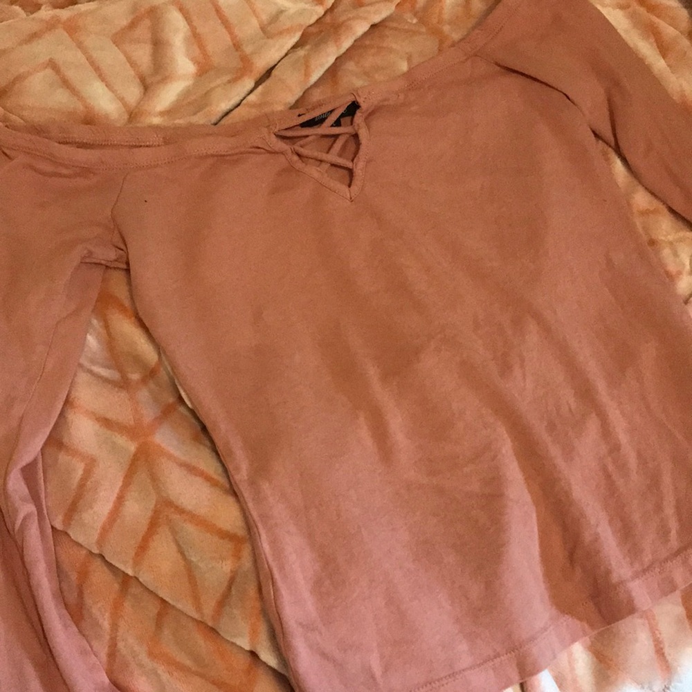 It’s a pink ambiance long sleeve shirt.